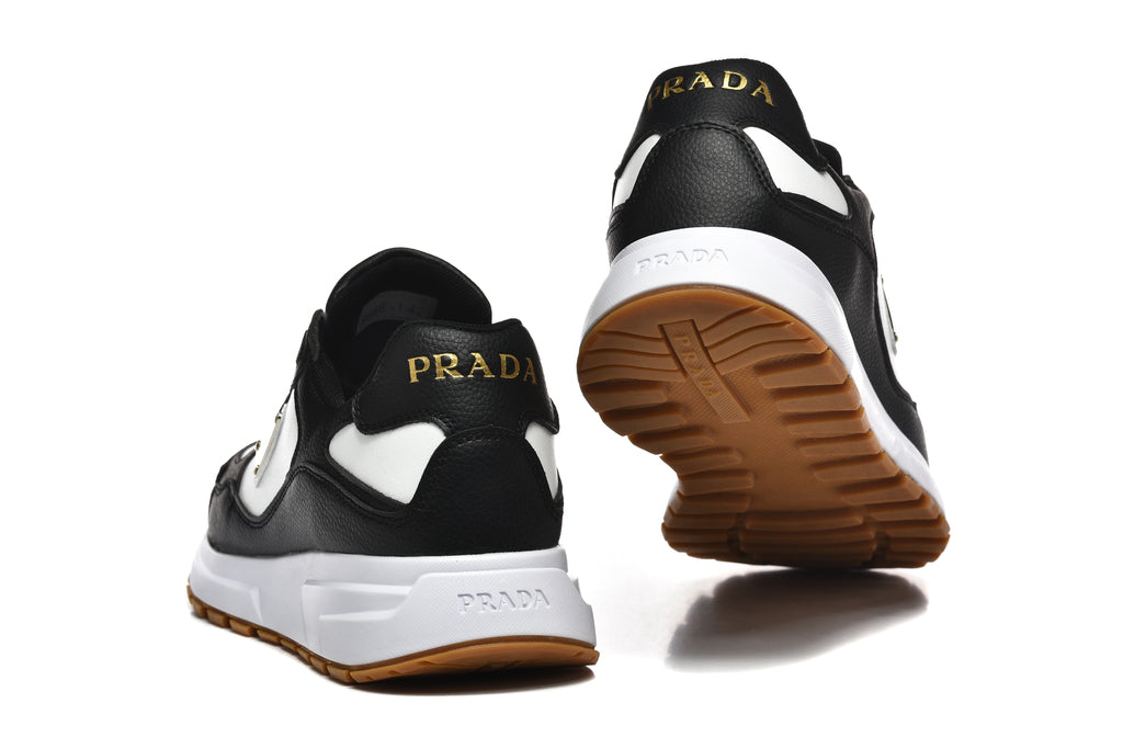 Prada Triangle Logo Low-Top Sneakers - Black & White with Gold Heel Lettering