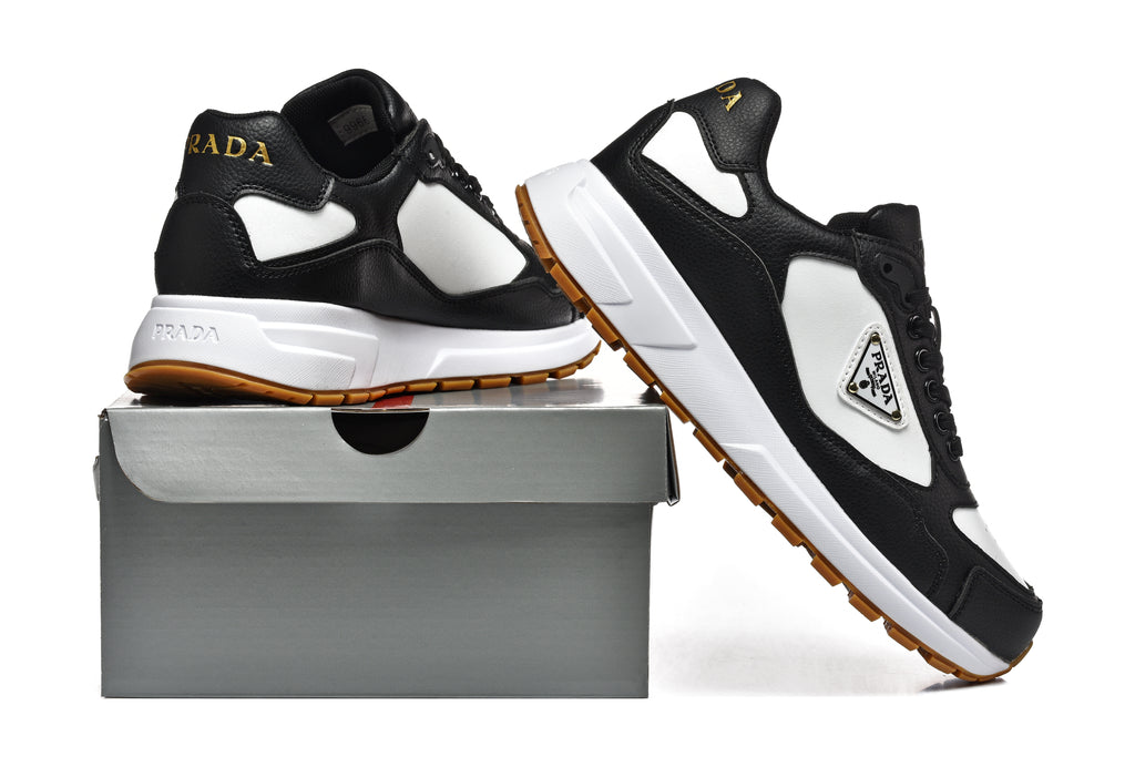 Prada Triangle Logo Low-Top Sneakers - Black & White with Gold Heel Lettering