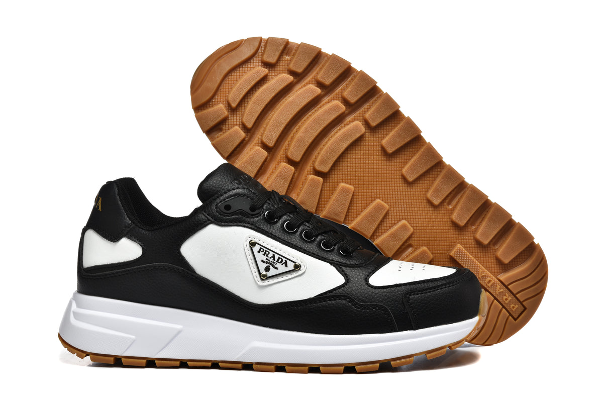 Prada Triangle Logo Low-Top Sneakers - Black & White with Gold Heel Lettering