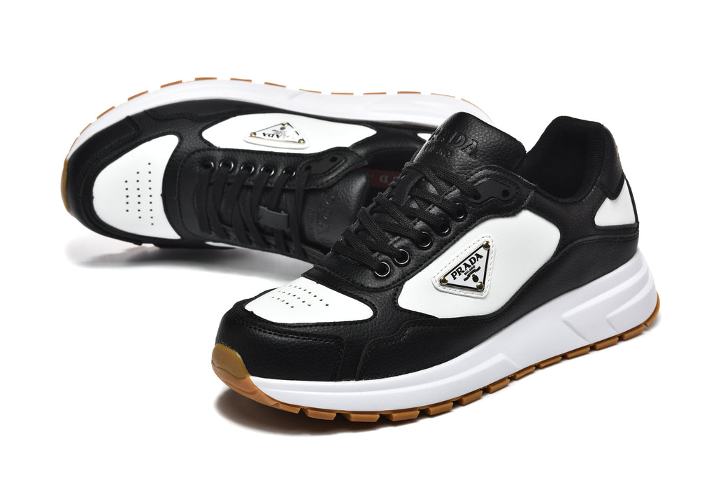 Prada Triangle Logo Low-Top Sneakers - Black & White with Gold Heel Lettering